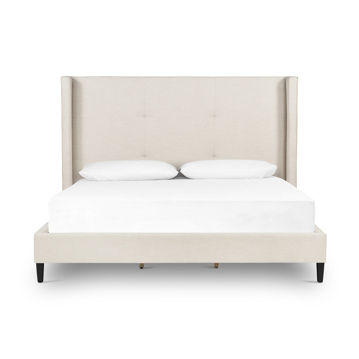 a white bed with a headboard