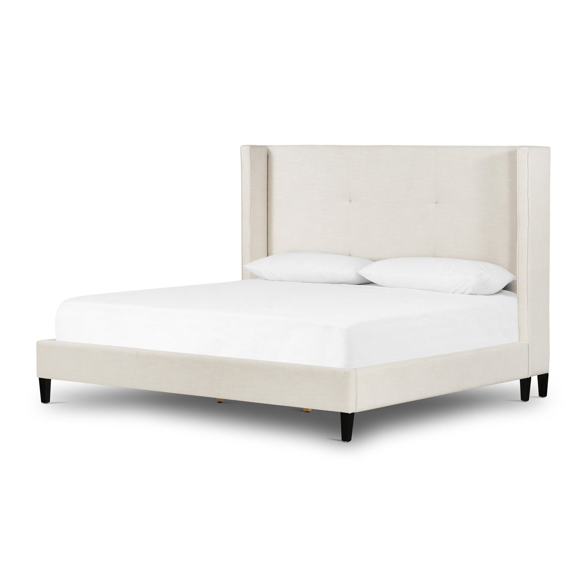 a white bed with white sheets