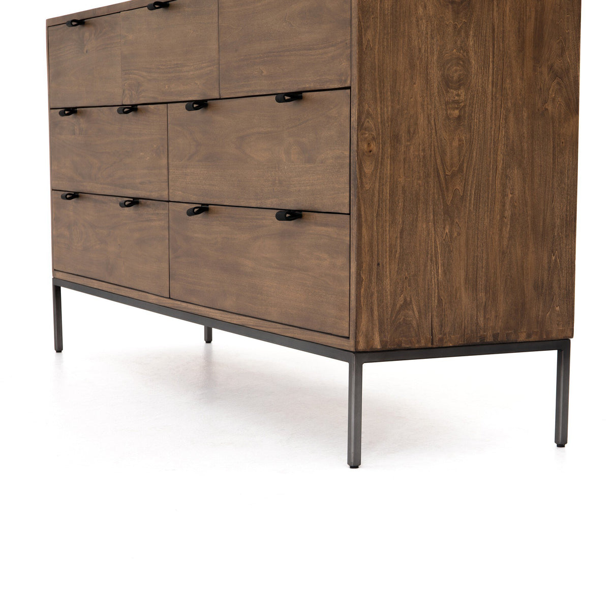 a brown dresser with black handles