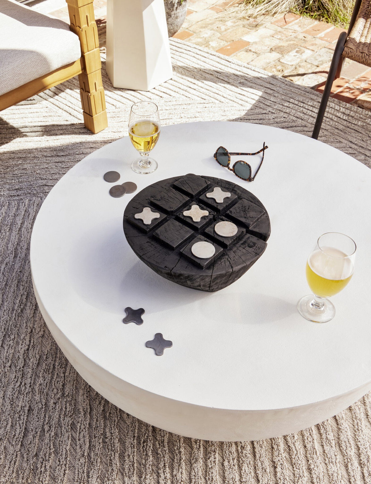 a table with a game on it and glasses of wine on it