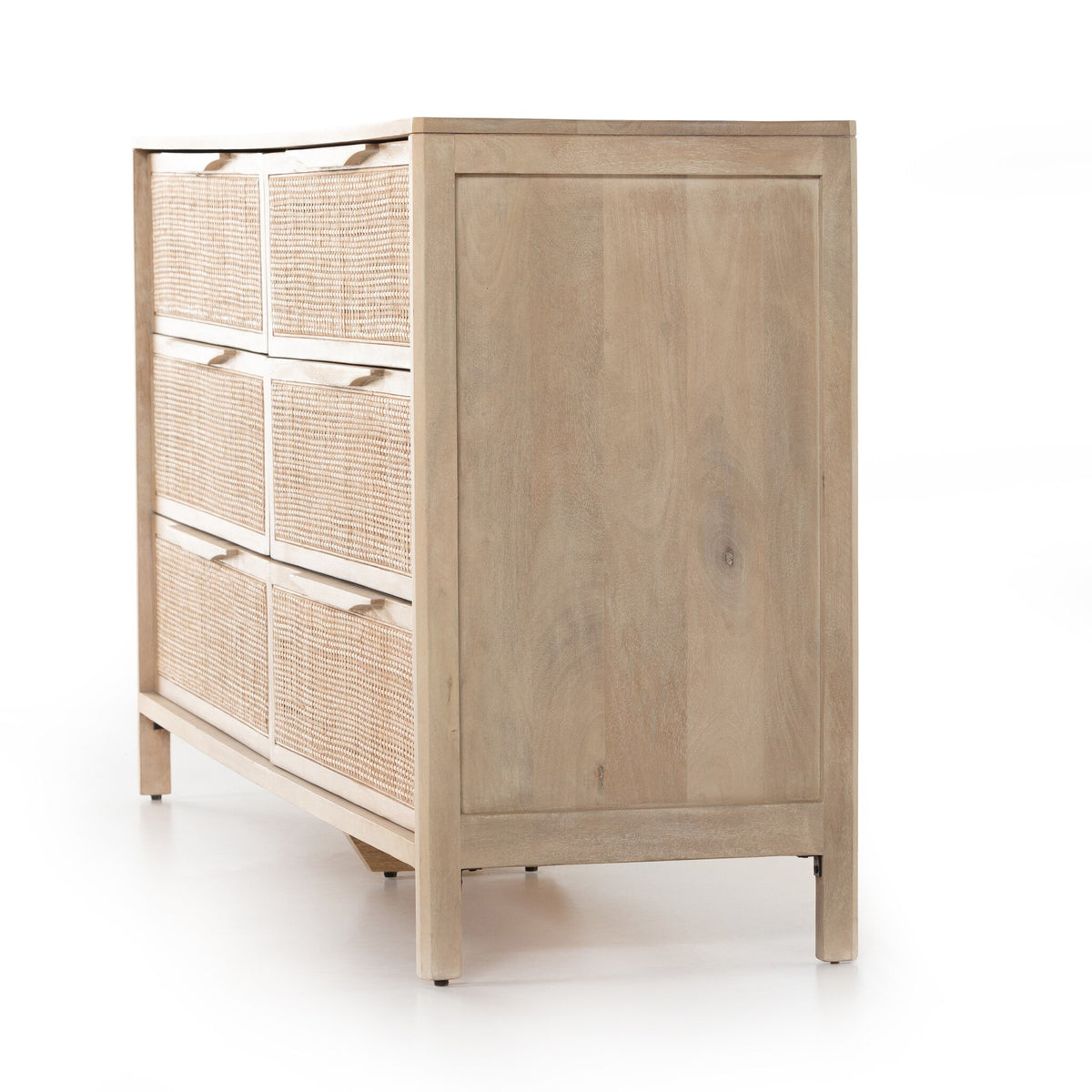 a wooden dresser with wicker drawers