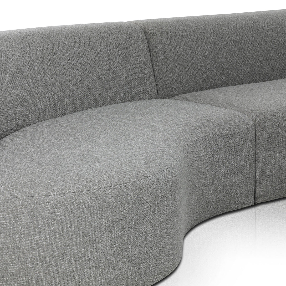 a grey couch with a curved seat