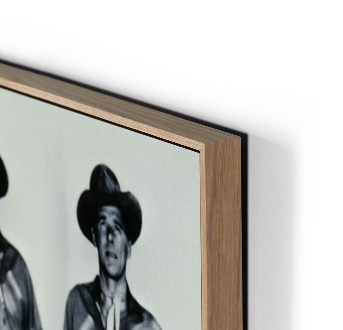 a framed picture of men in cowboy hats