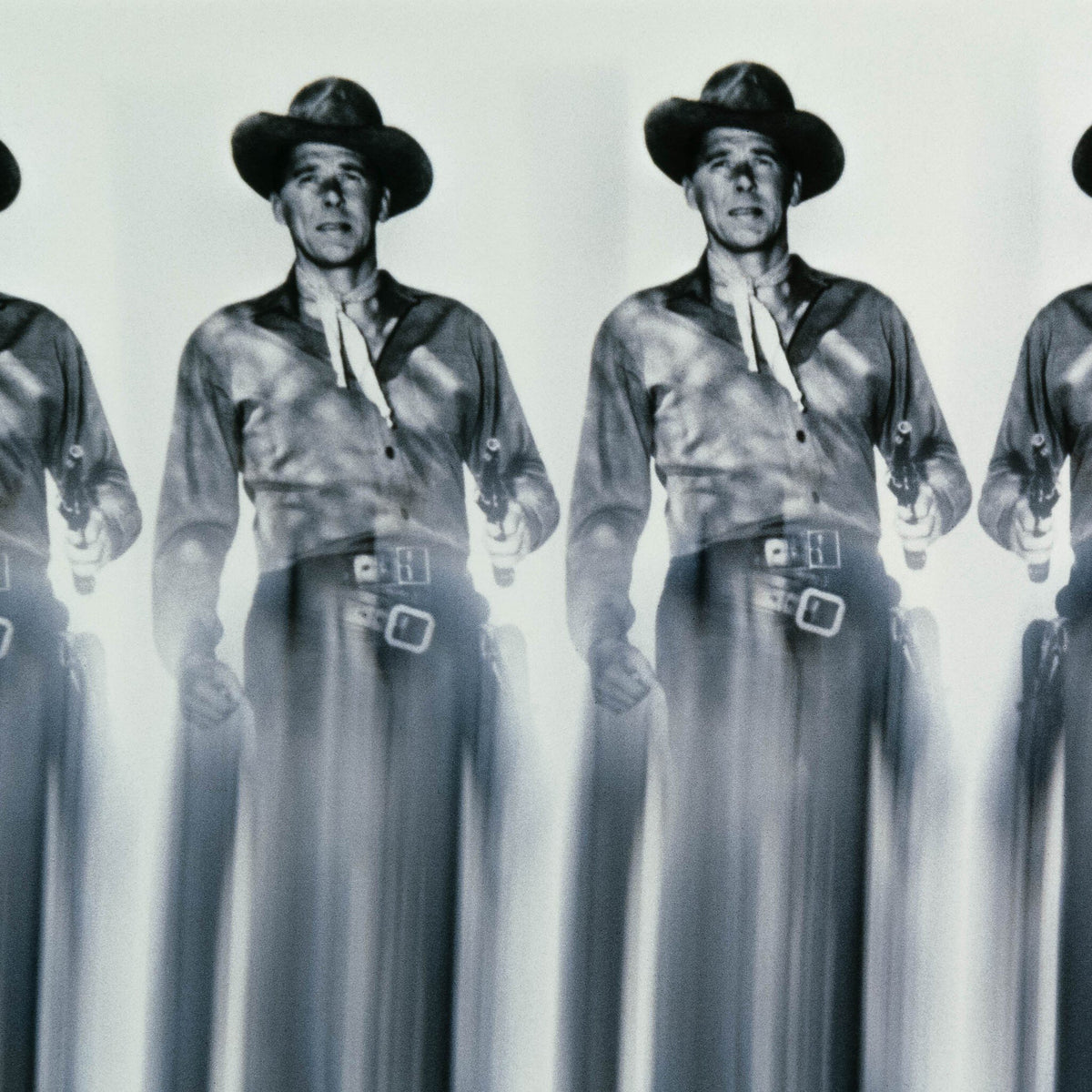a group of men in cowboy clothes