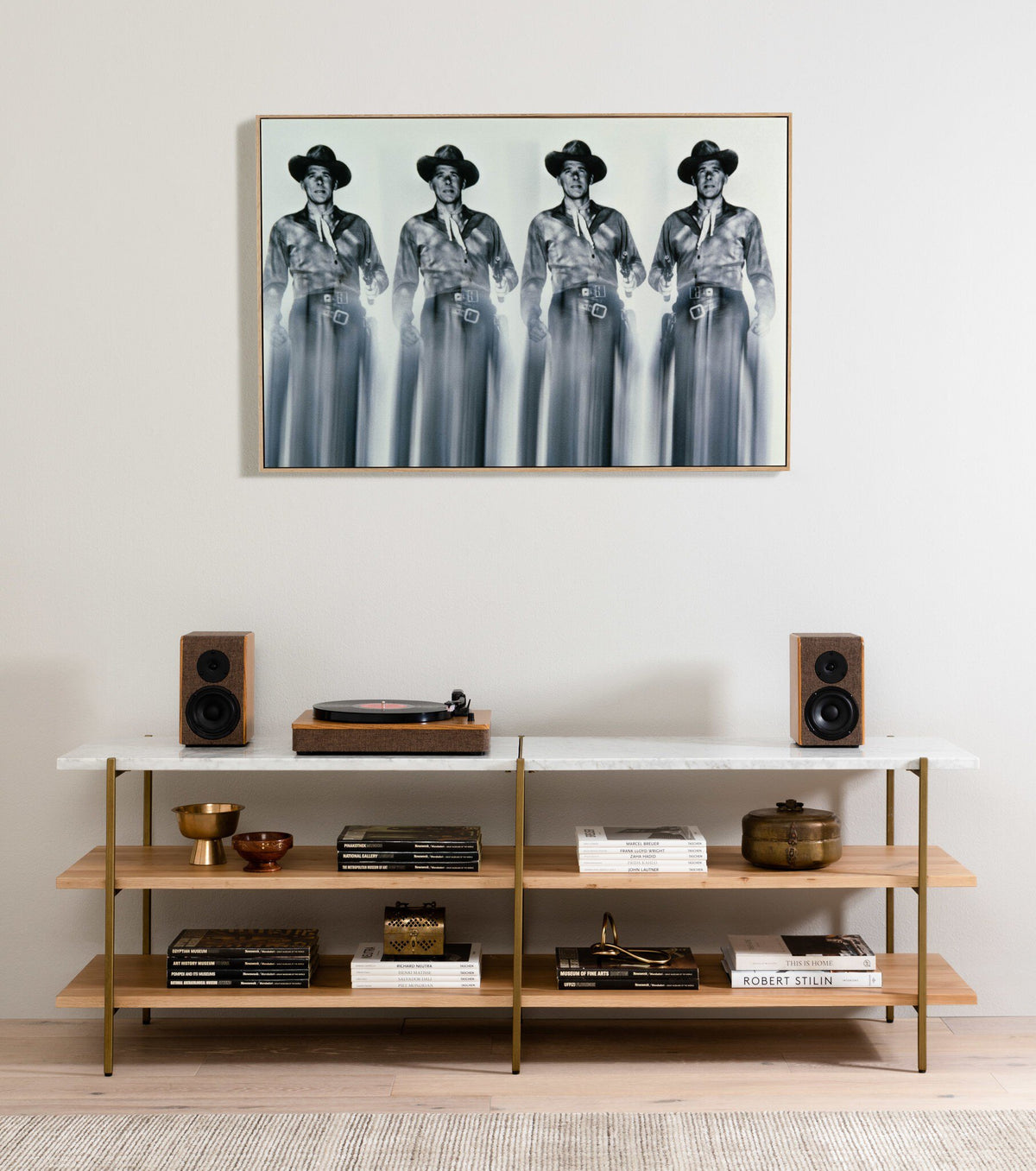 a shelf with books and a picture of a group of men on it