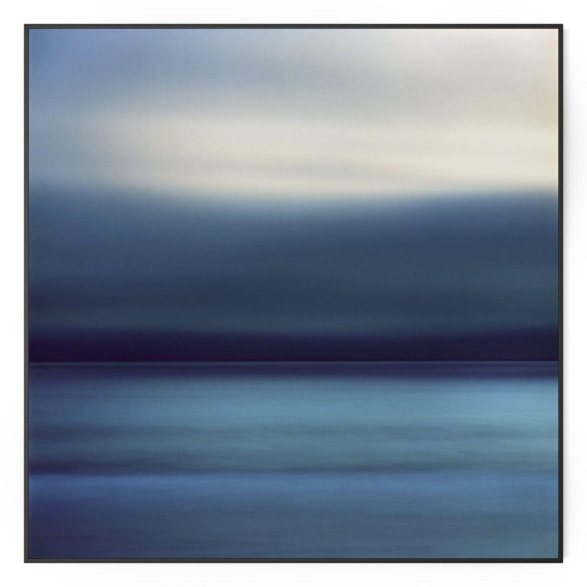 a blue and grey sky over water
