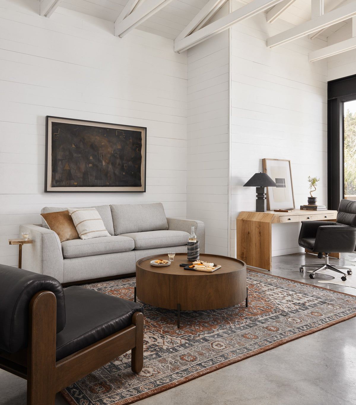 a living room with a couch and a table