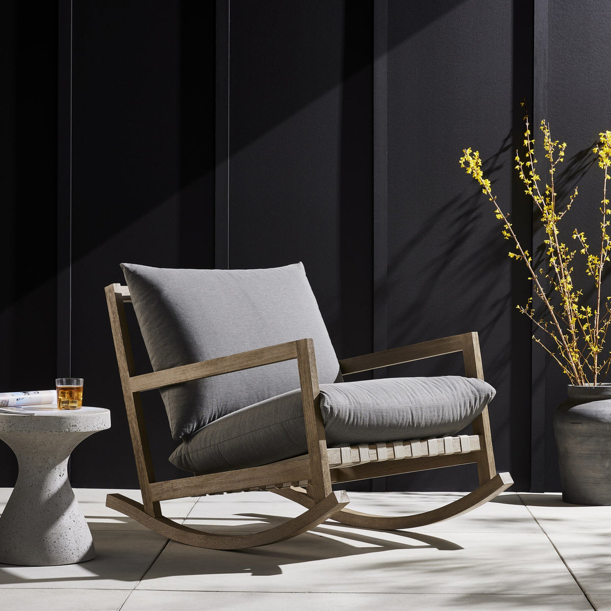 a chair and a table on a patio