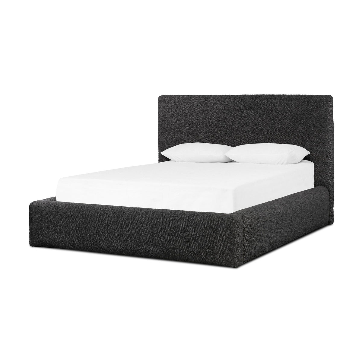 a bed with white sheets and pillows