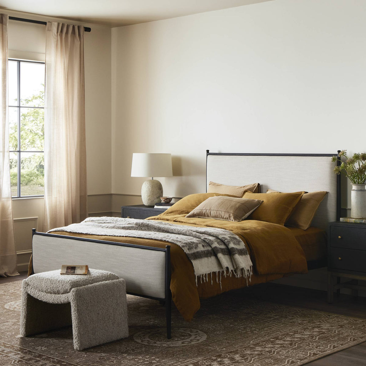 a bed with a bed and a table with a lamp