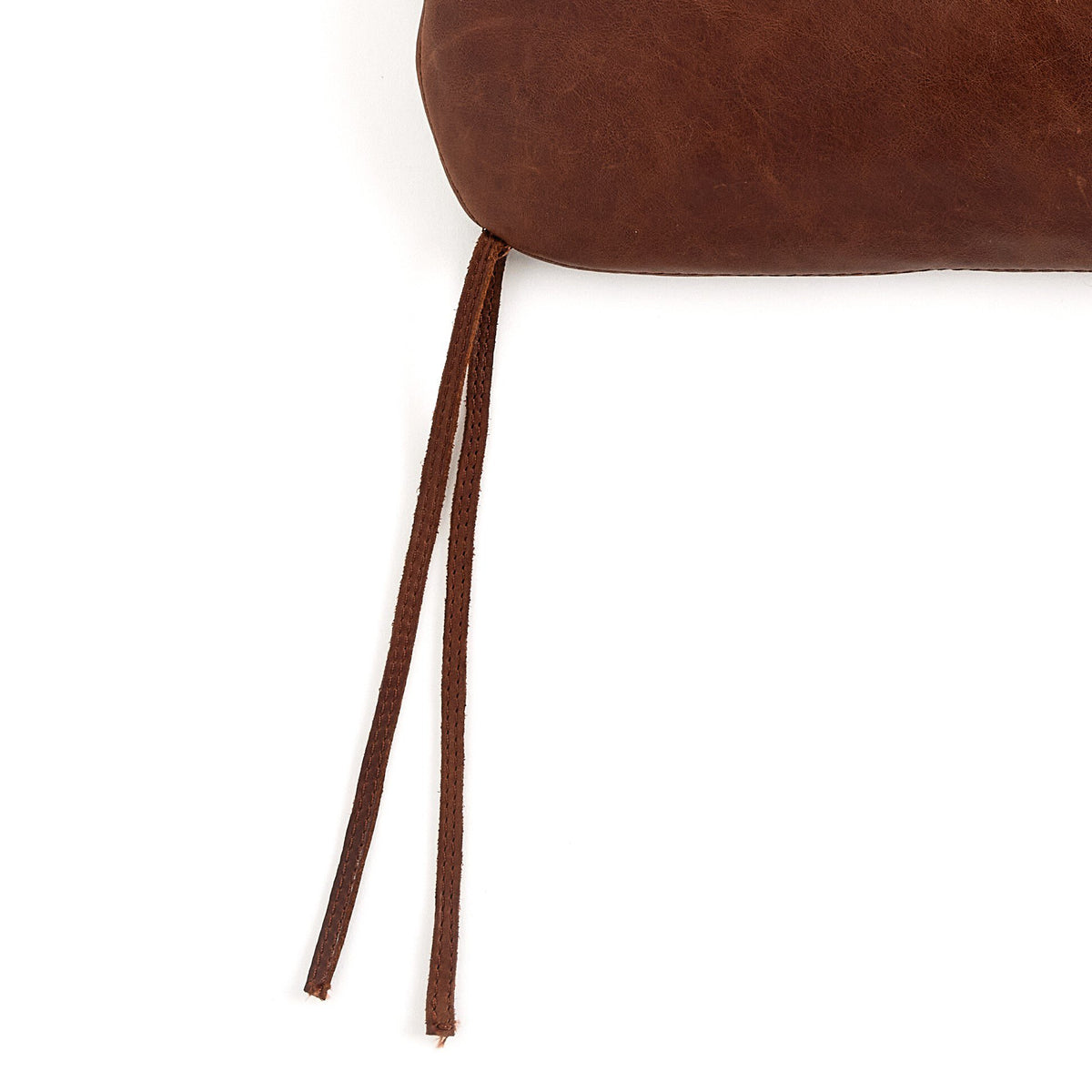 a brown pillow with a string