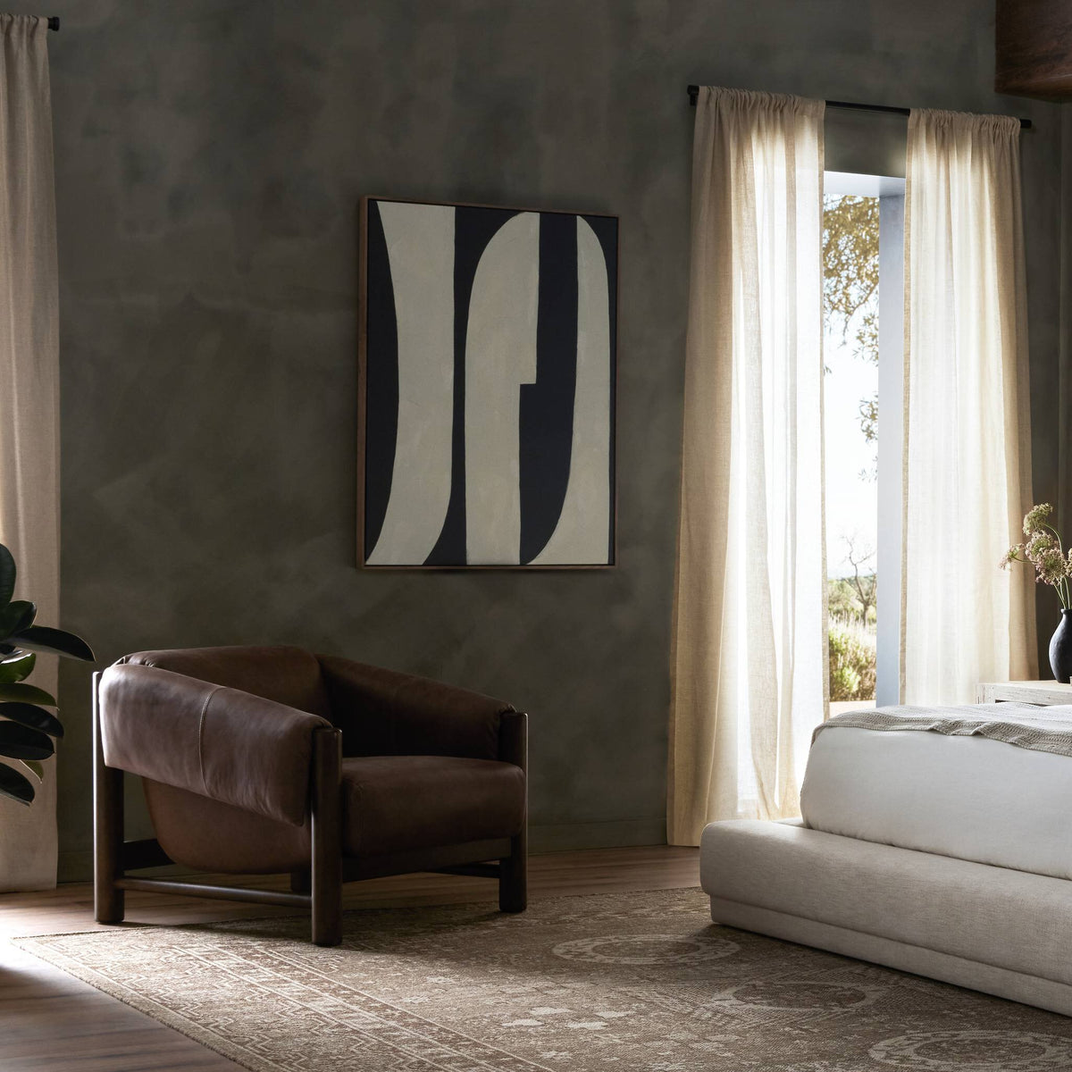 a room with a bed and chair