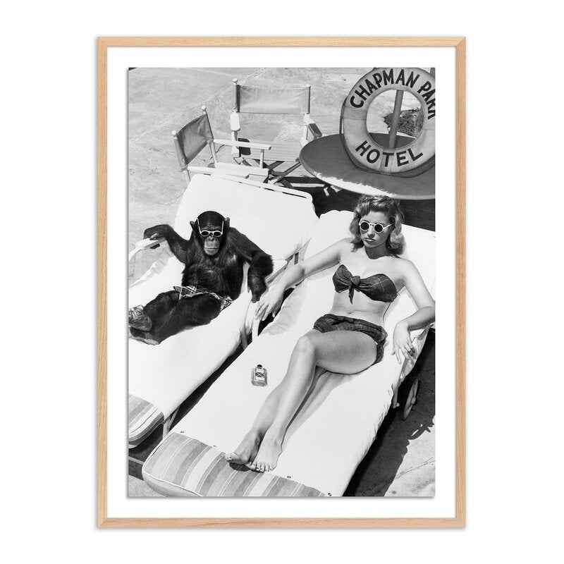 Woman Sunbathing With Chimpanzee By Getty Images