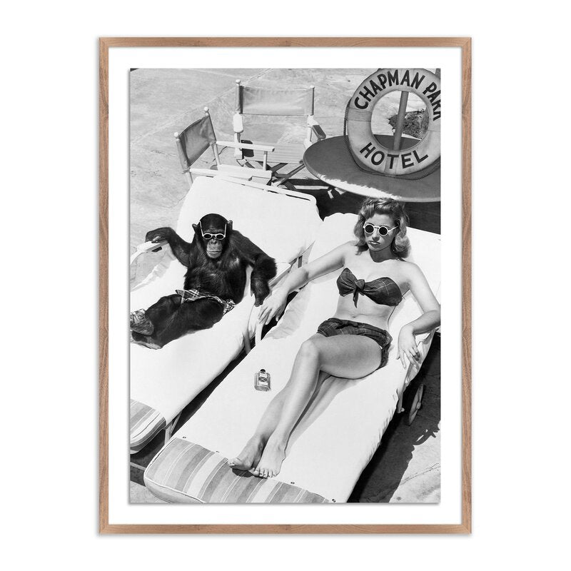 Woman Sunbathing With Chimpanzee By Getty Images