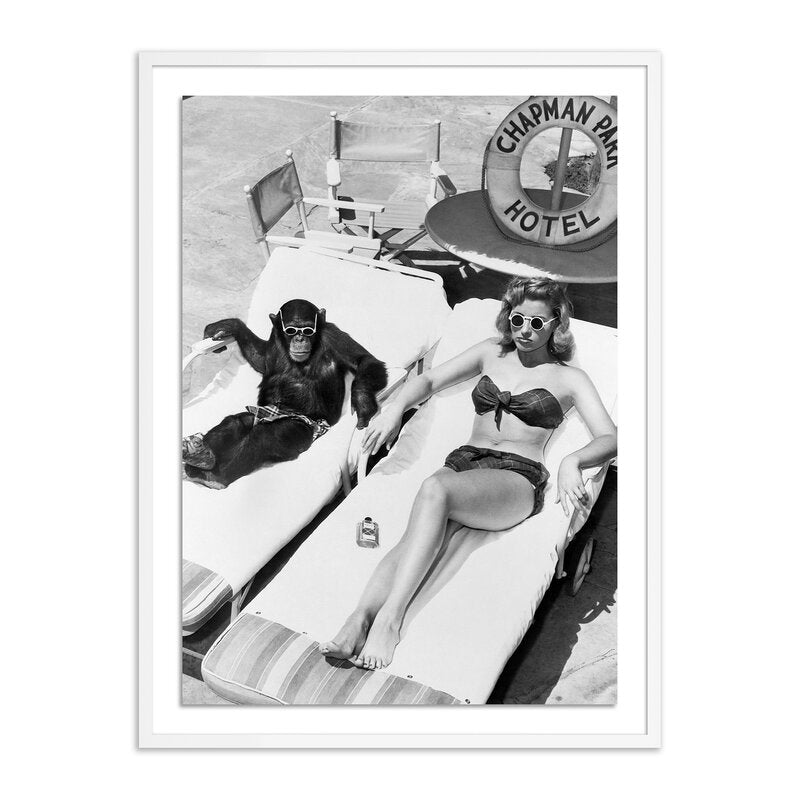 Woman Sunbathing With Chimpanzee By Getty Images