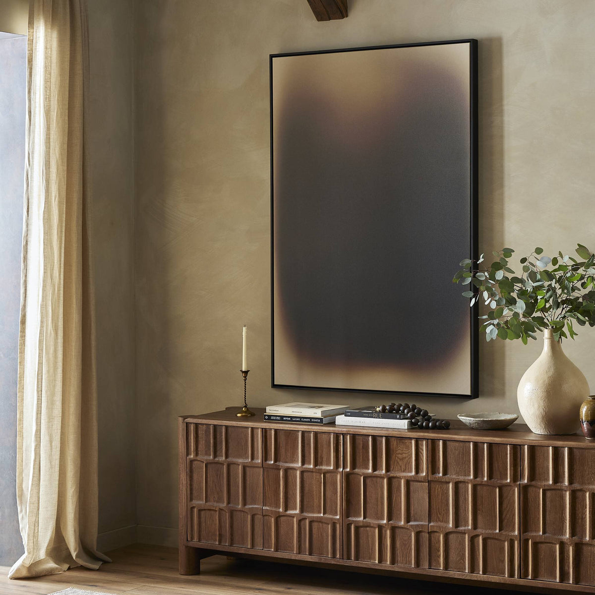 a room with a large painting on the wall