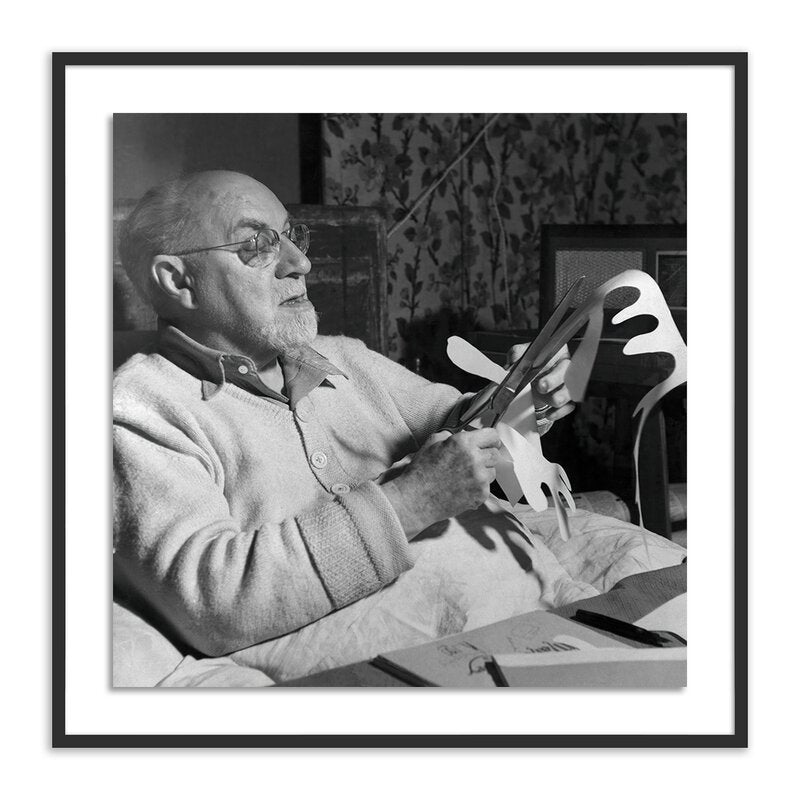 a man holding a paper piece