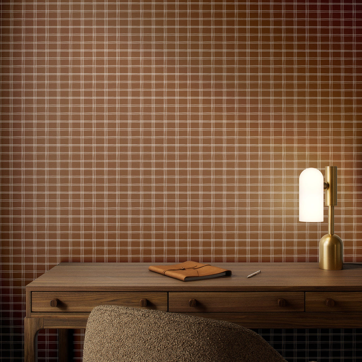 a desk with a lamp and a notebook on it