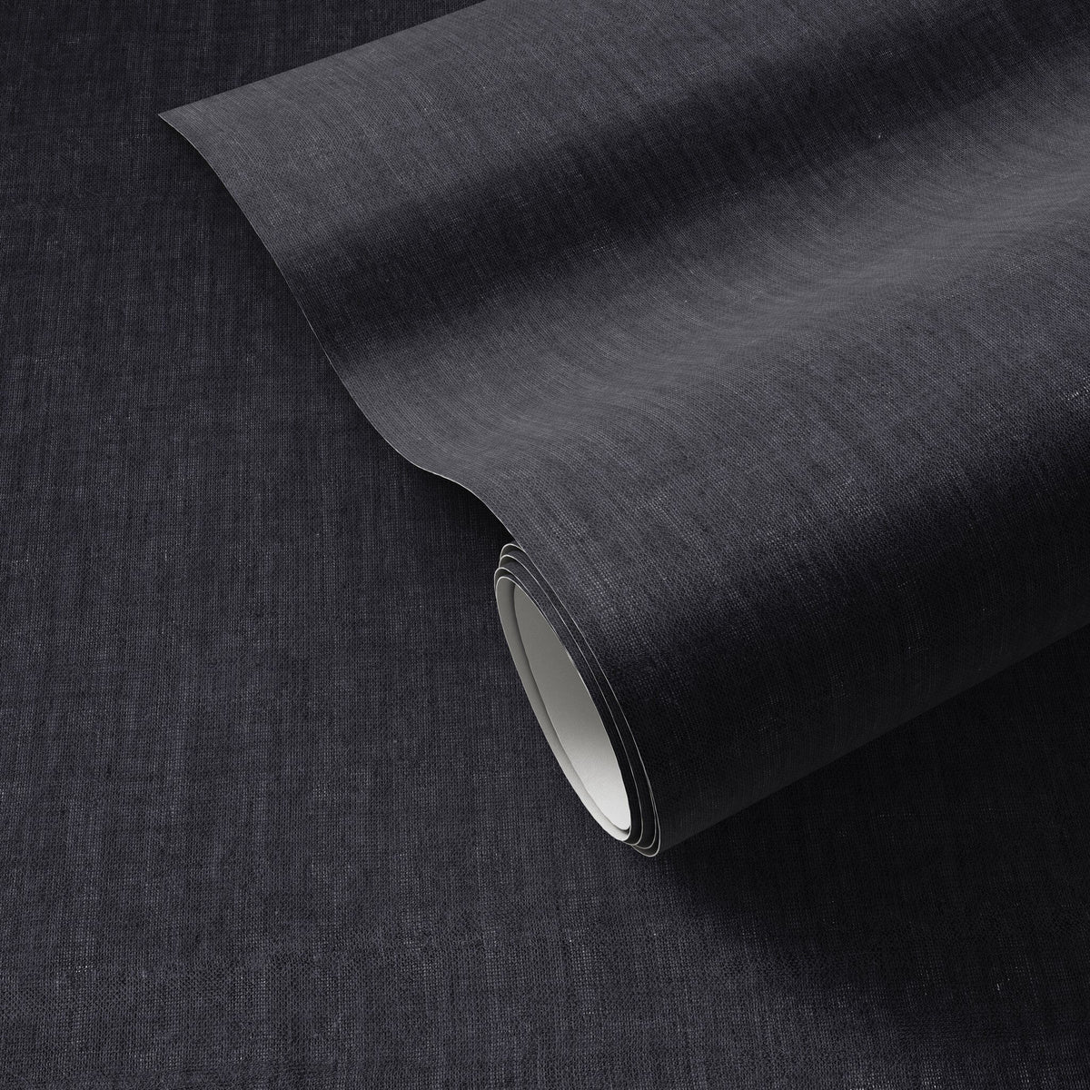 a black fabric roll on a black surface