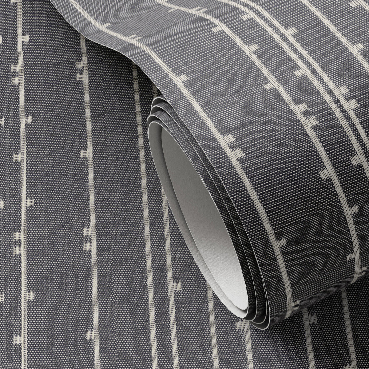 a roll of fabric with white and black lines