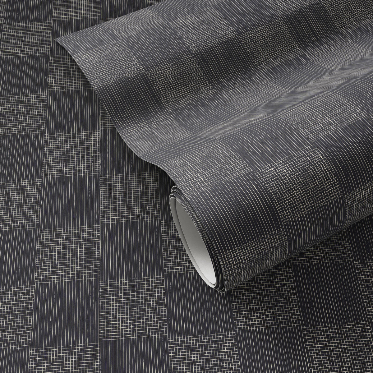 a roll of black and white wallpaper