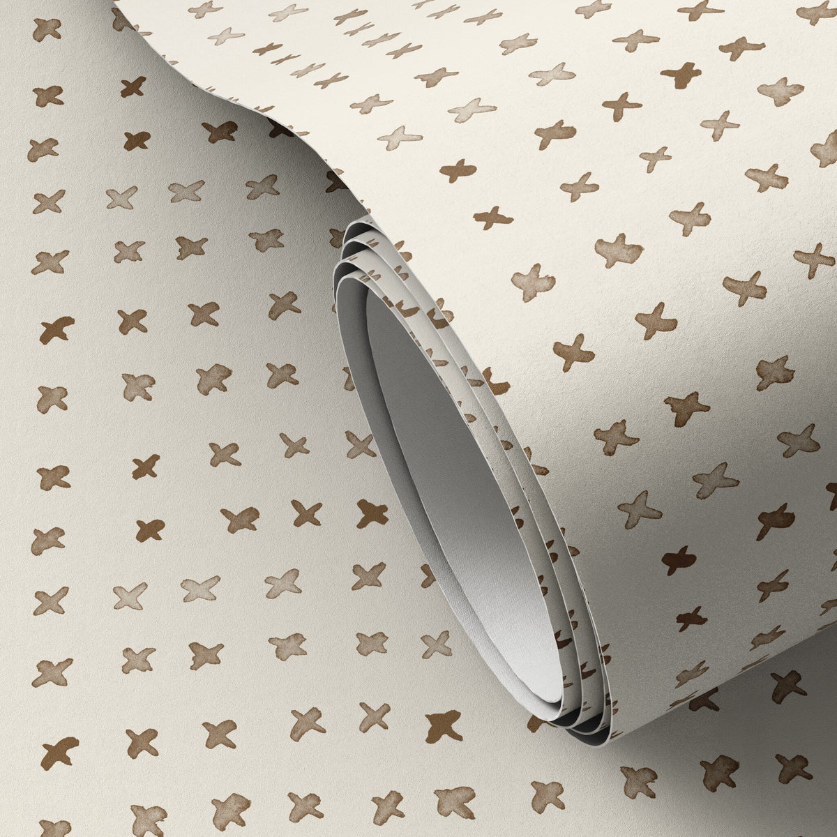 a roll of wallpaper with brown crosses