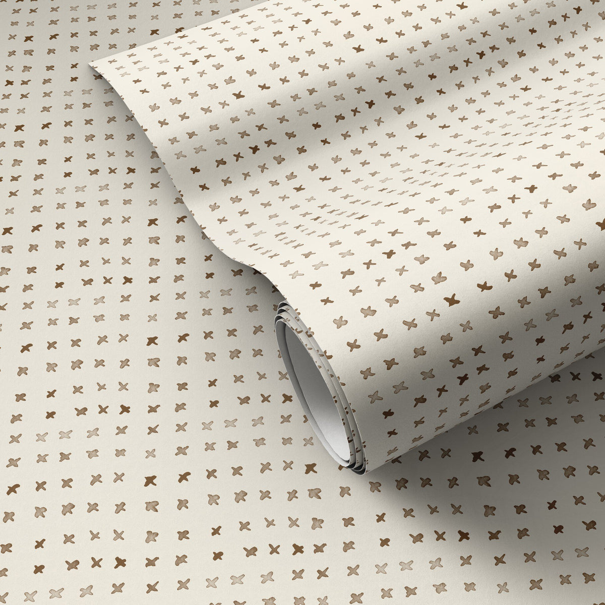 a roll of white and brown wallpaper