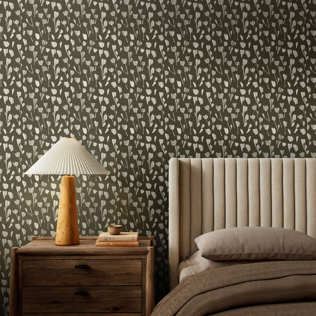 a bed with a lamp on a nightstand