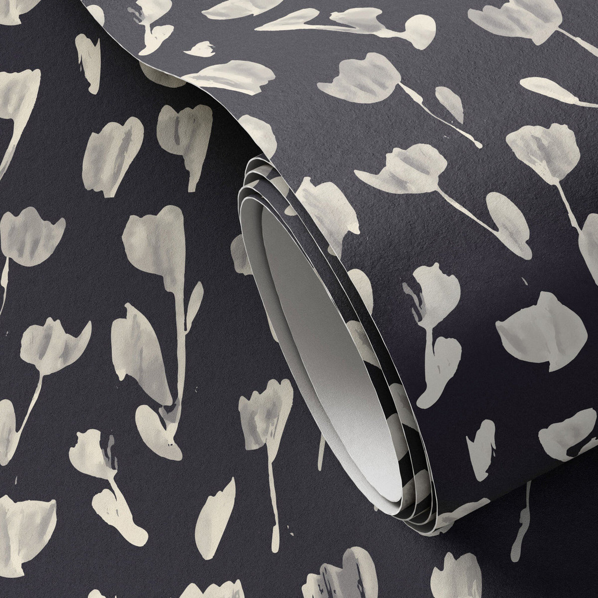 a roll of black and white floral wallpaper