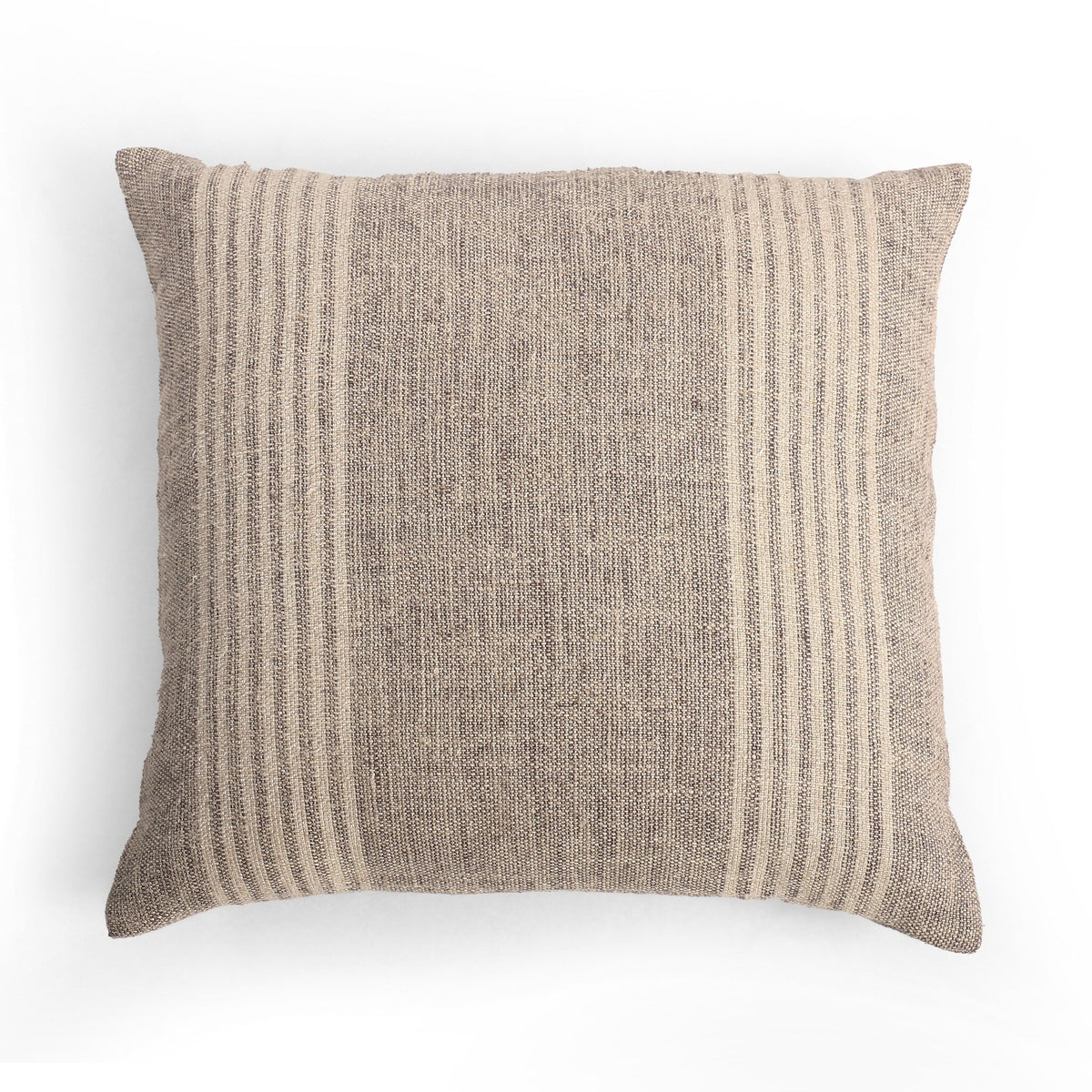 a pillow on a white surface