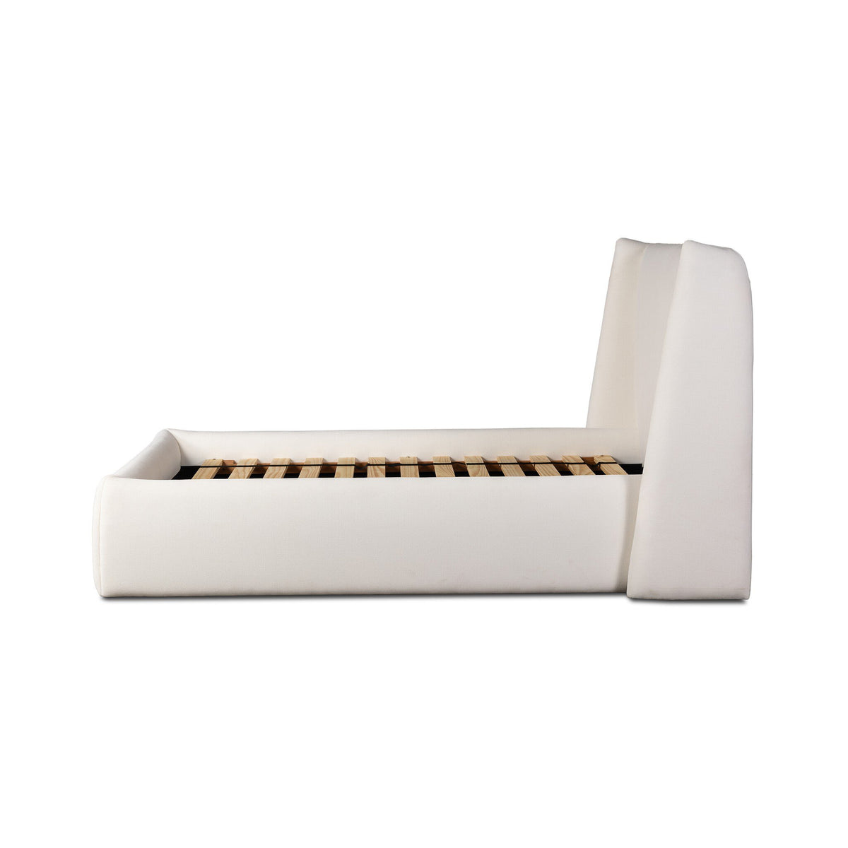 a white bed with a wooden bed frame
