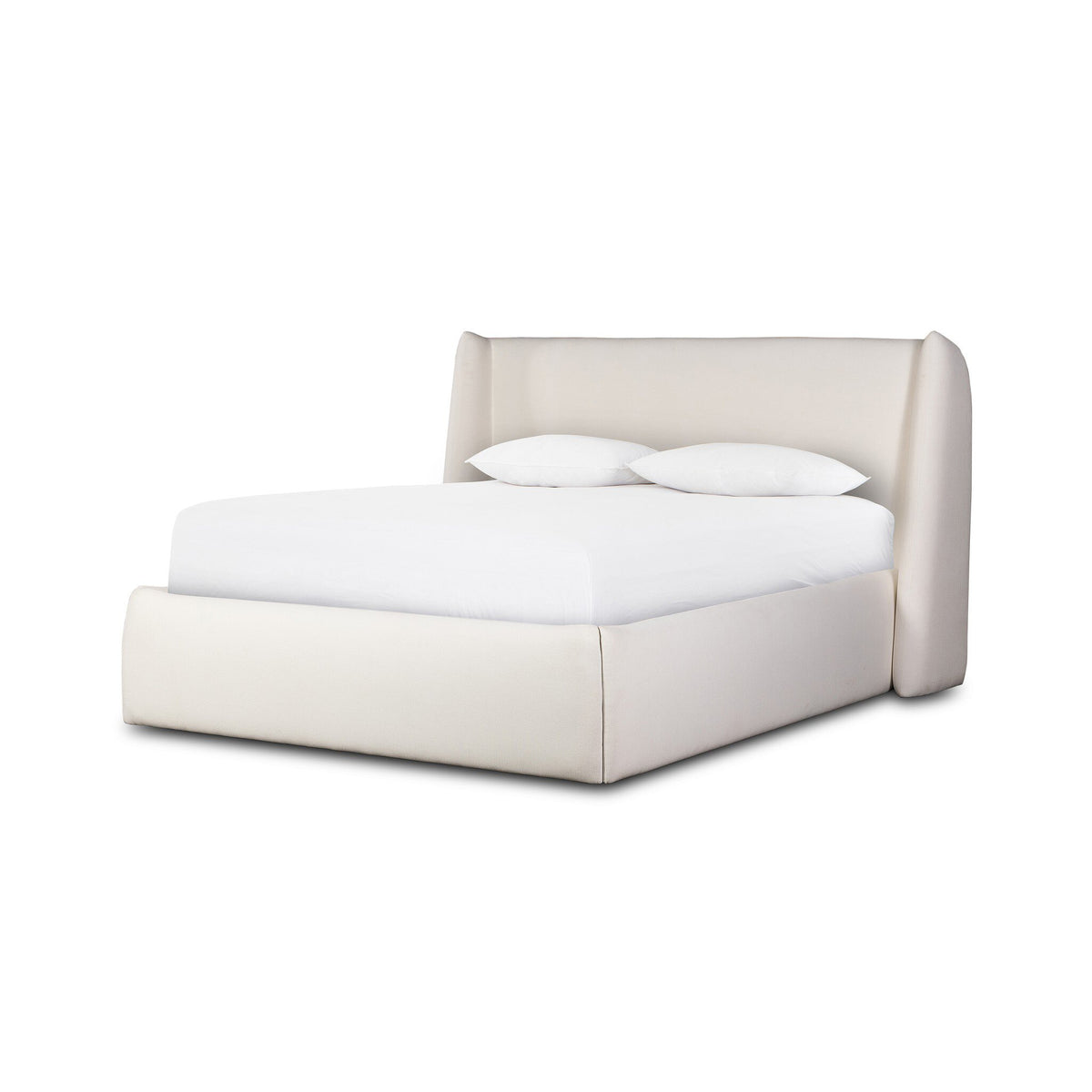a white bed with white sheets