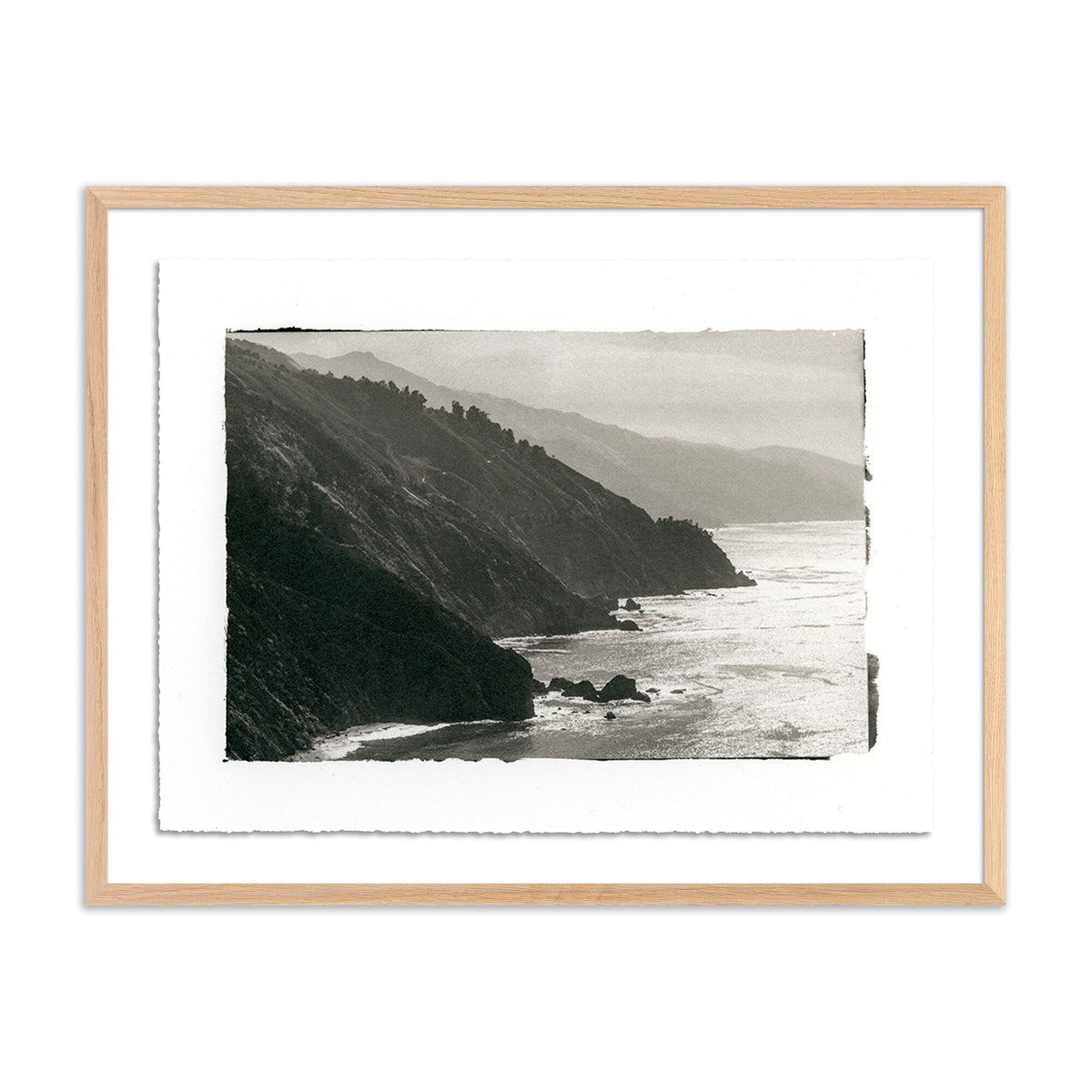 a framed picture of a beach