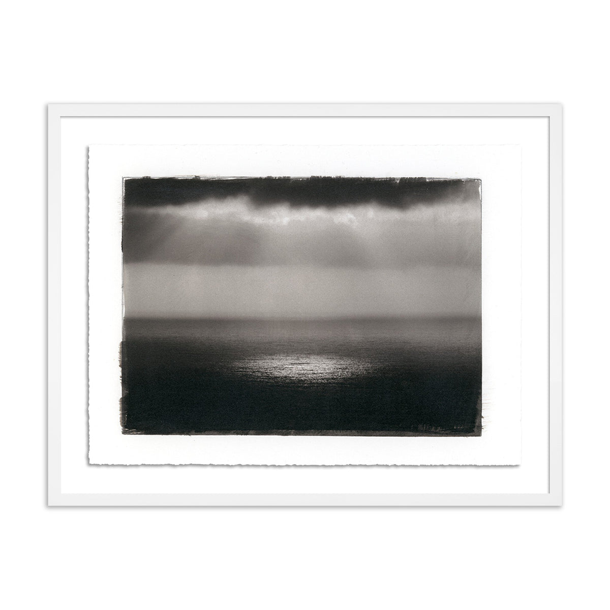 a framed picture of a sea