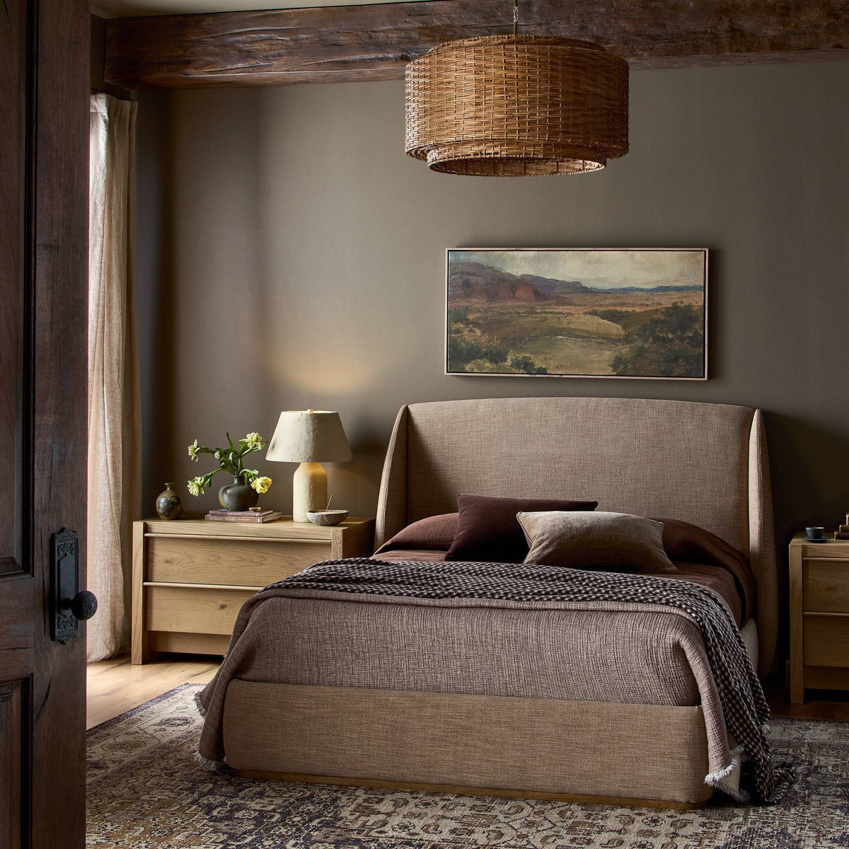 a bedroom with a bed and a rug