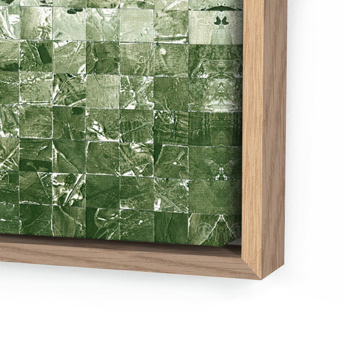 a green and white tile on a wooden frame