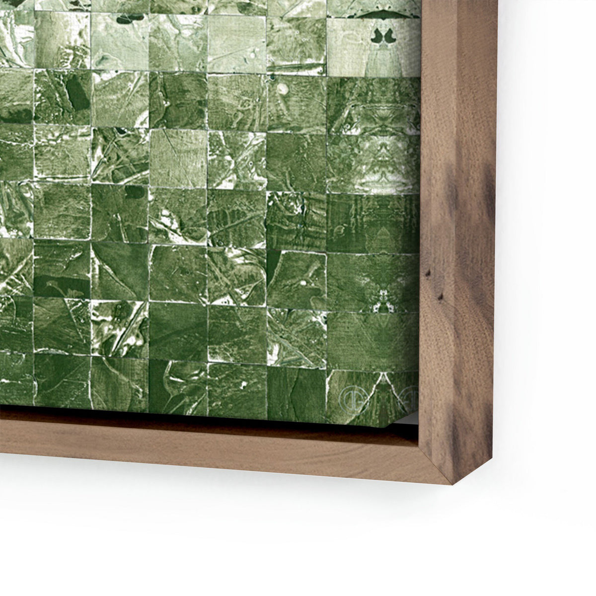 a green and white tile on a wooden frame