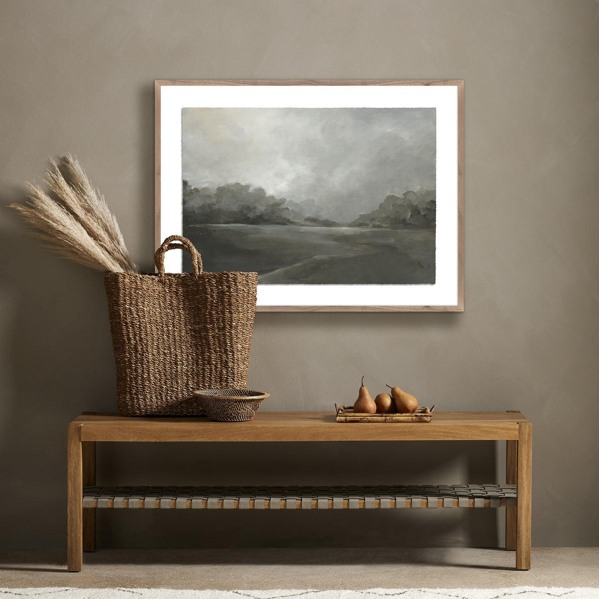 a bench with a painting on the wall