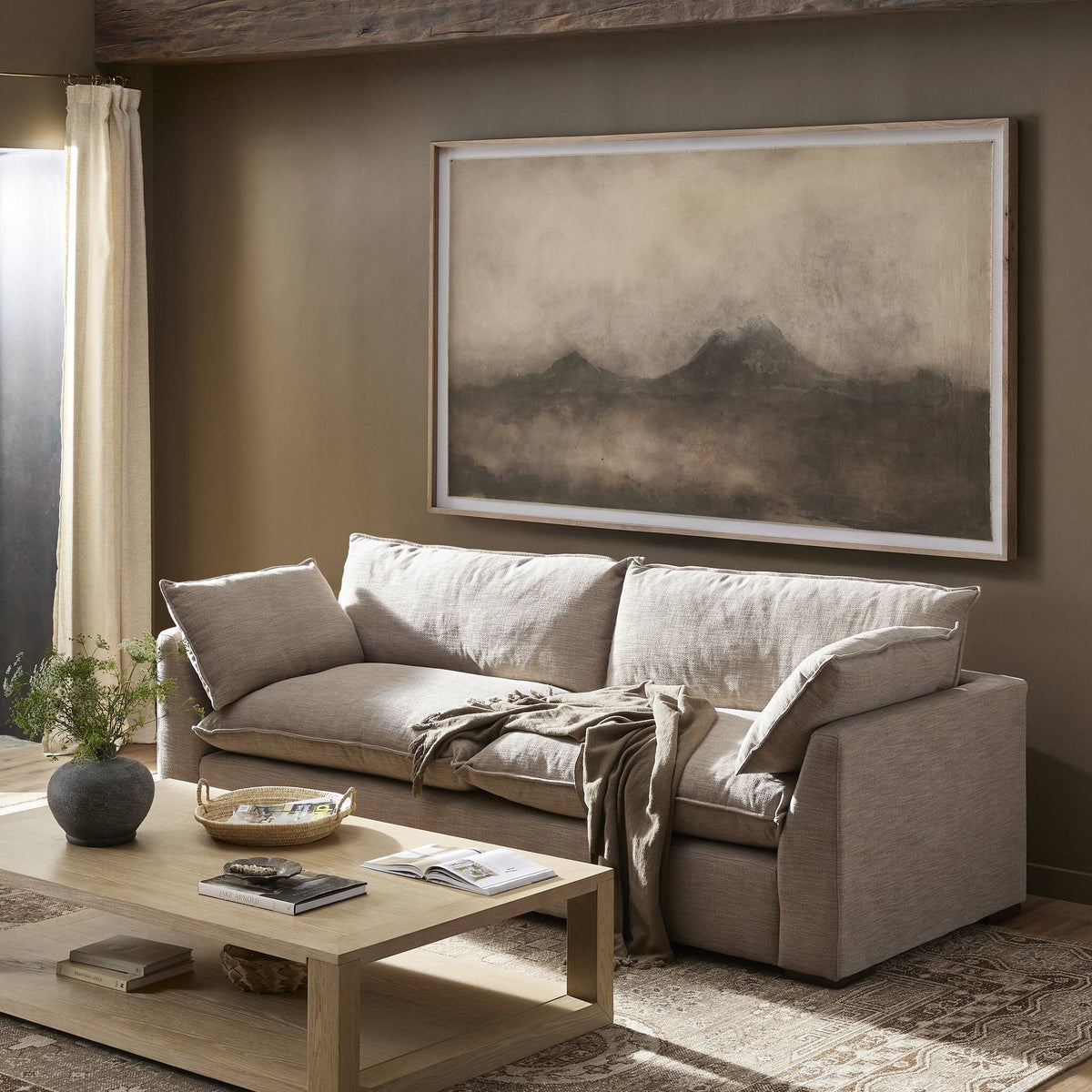 a living room with a couch and coffee table