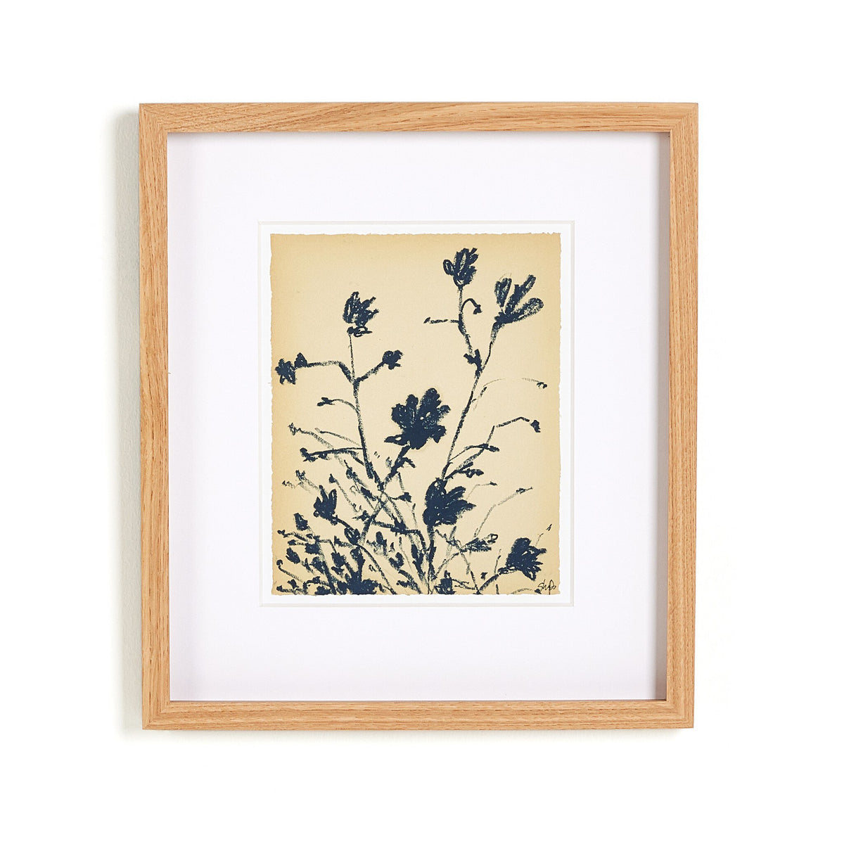 a picture frame with a plant on it