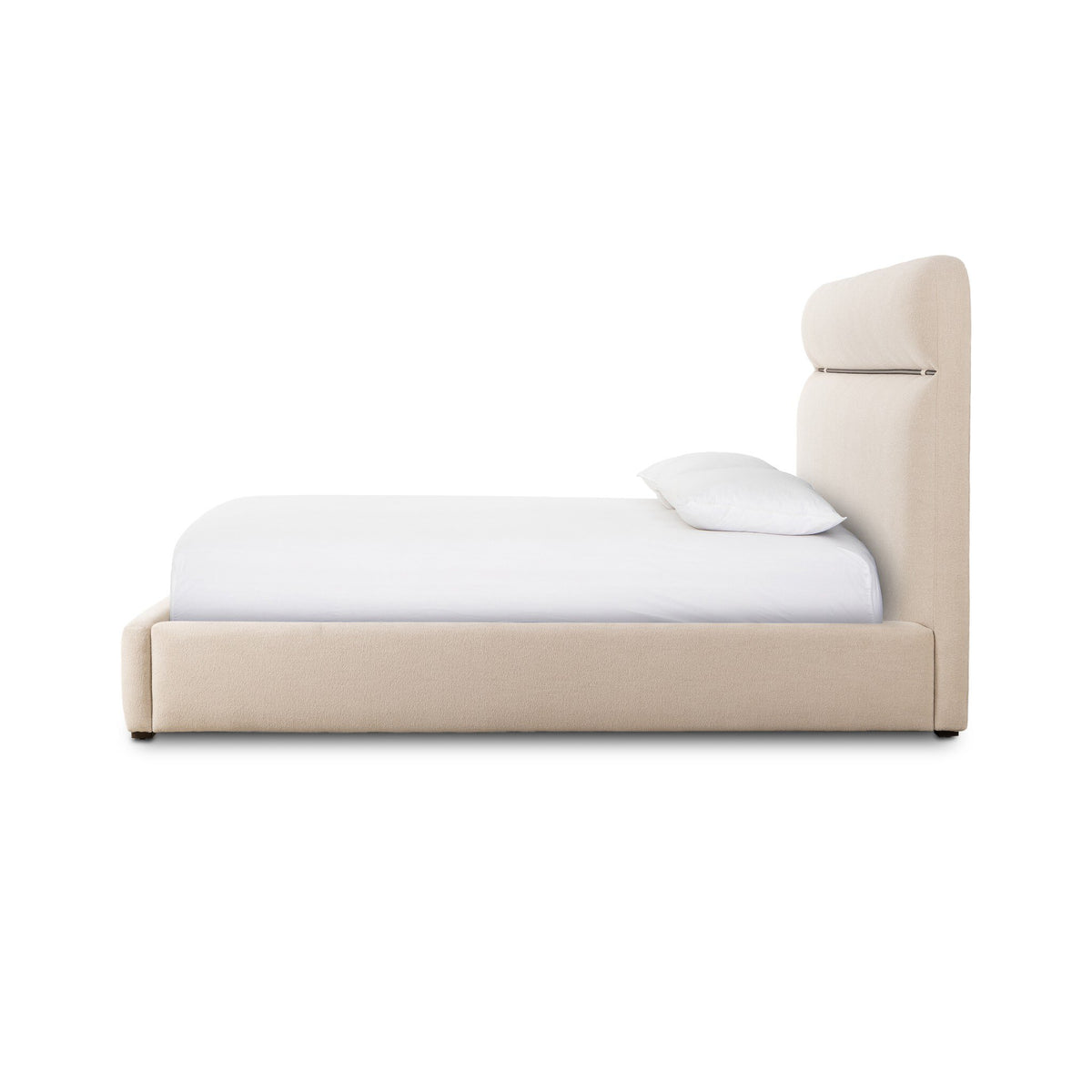 a bed with a white sheet and pillow