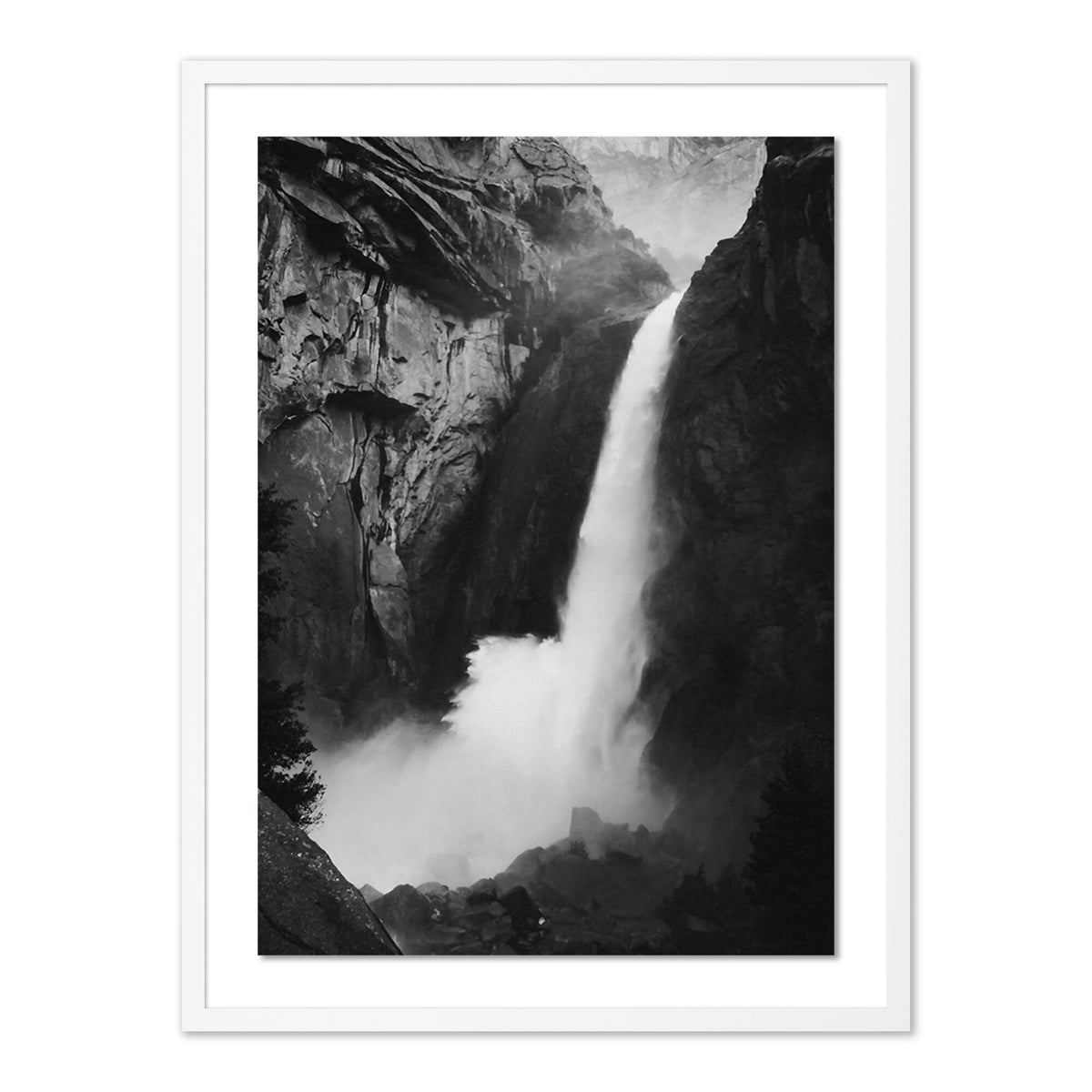 a waterfall in a black and white photo