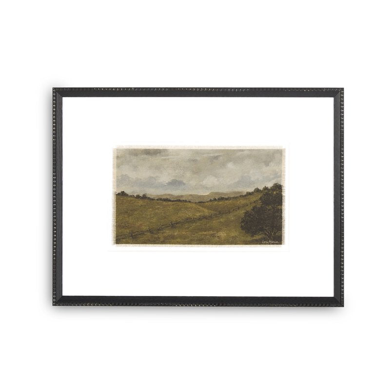 a framed picture of a landscape