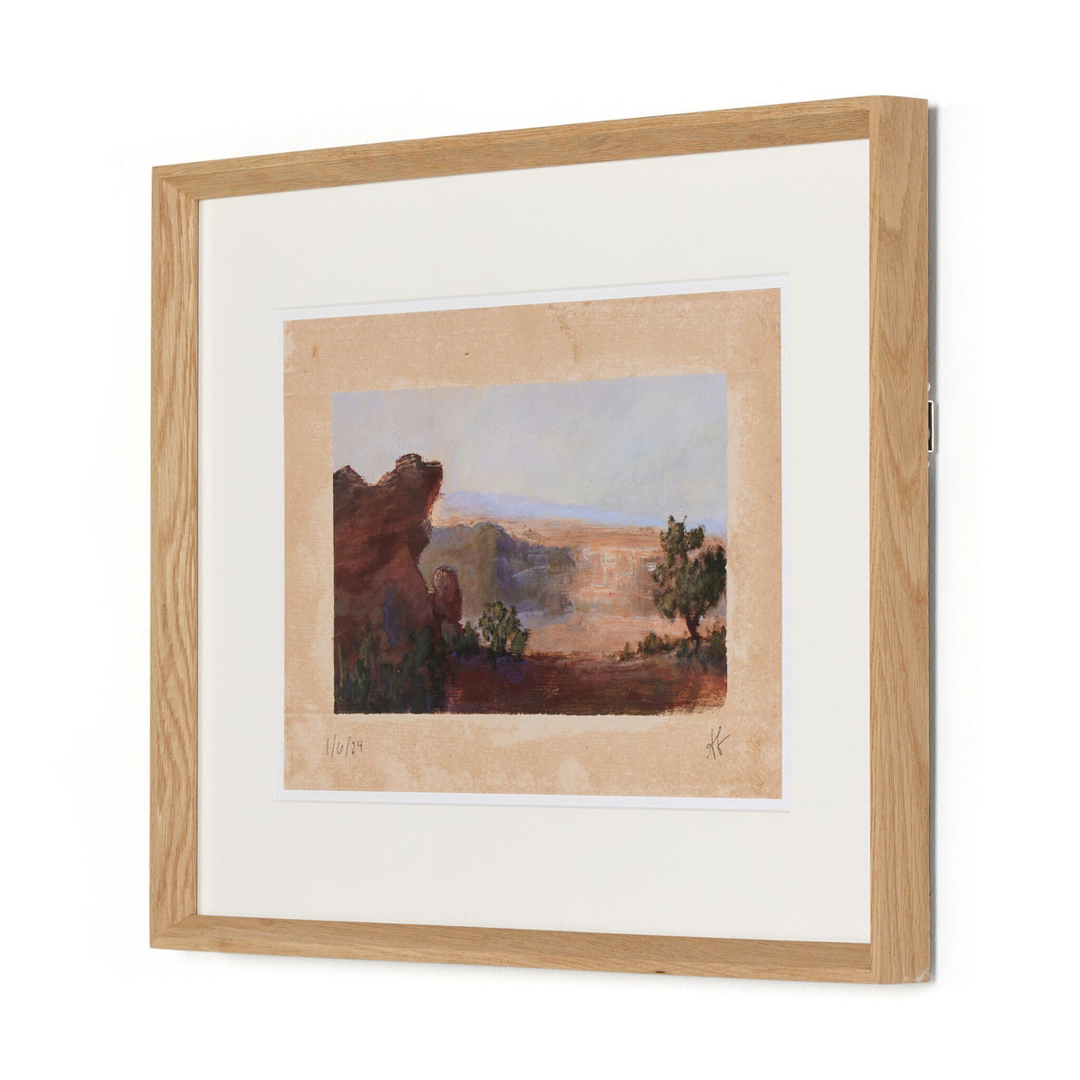 a framed picture of a landscape