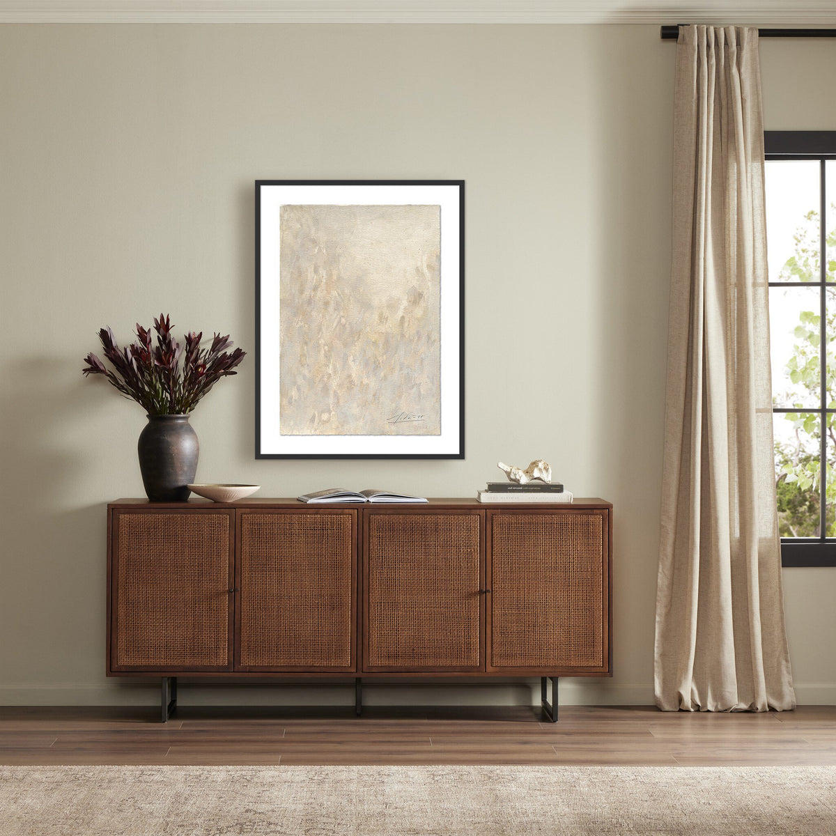 a room with a cabinet and a picture on the wall