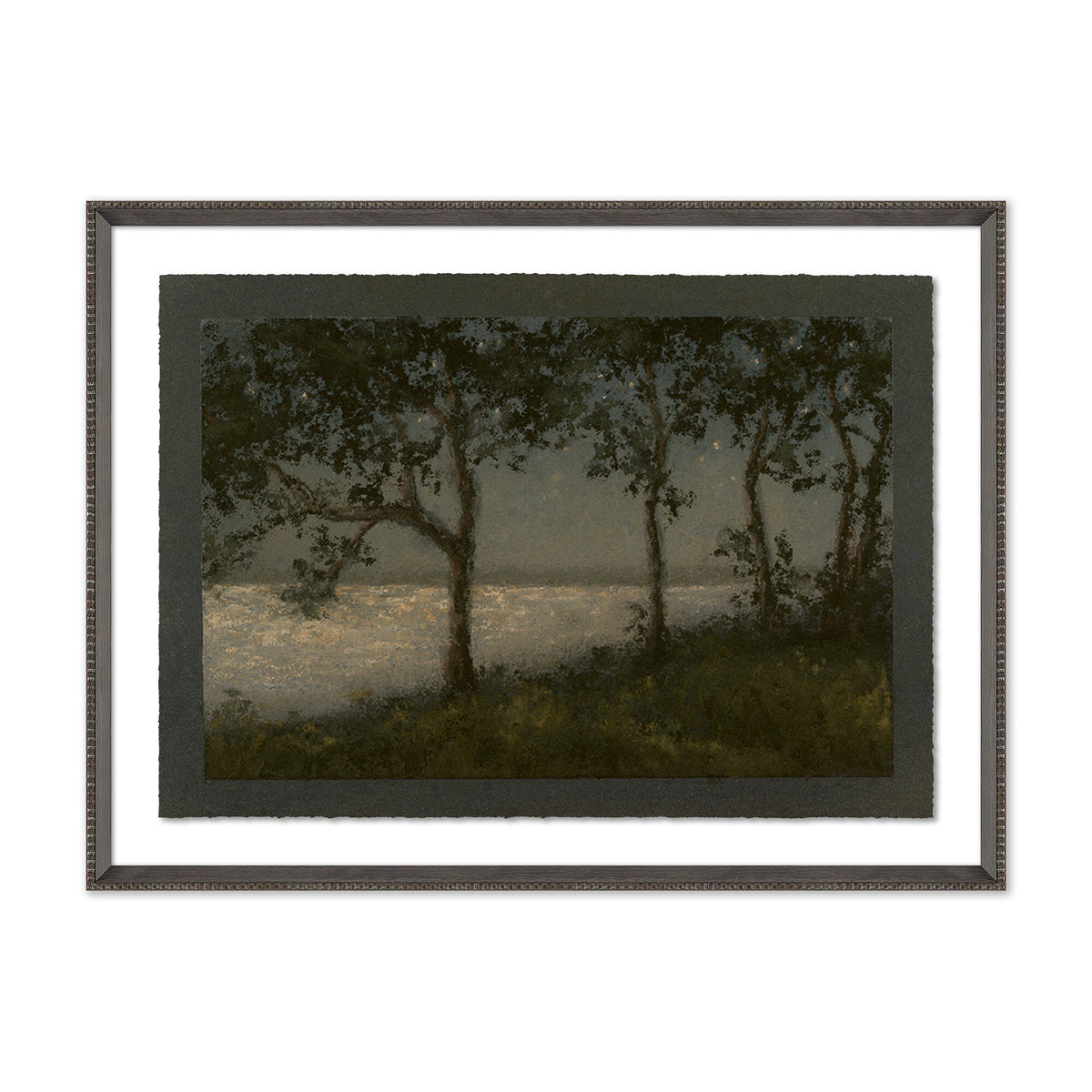 a framed picture of trees and water