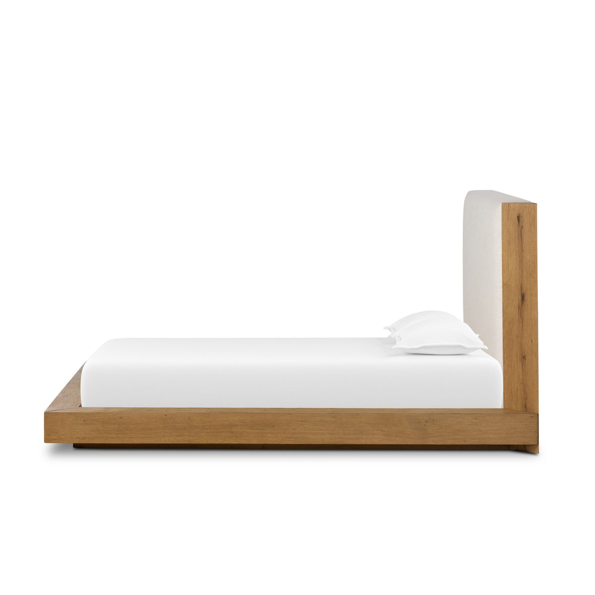 a bed with white sheets