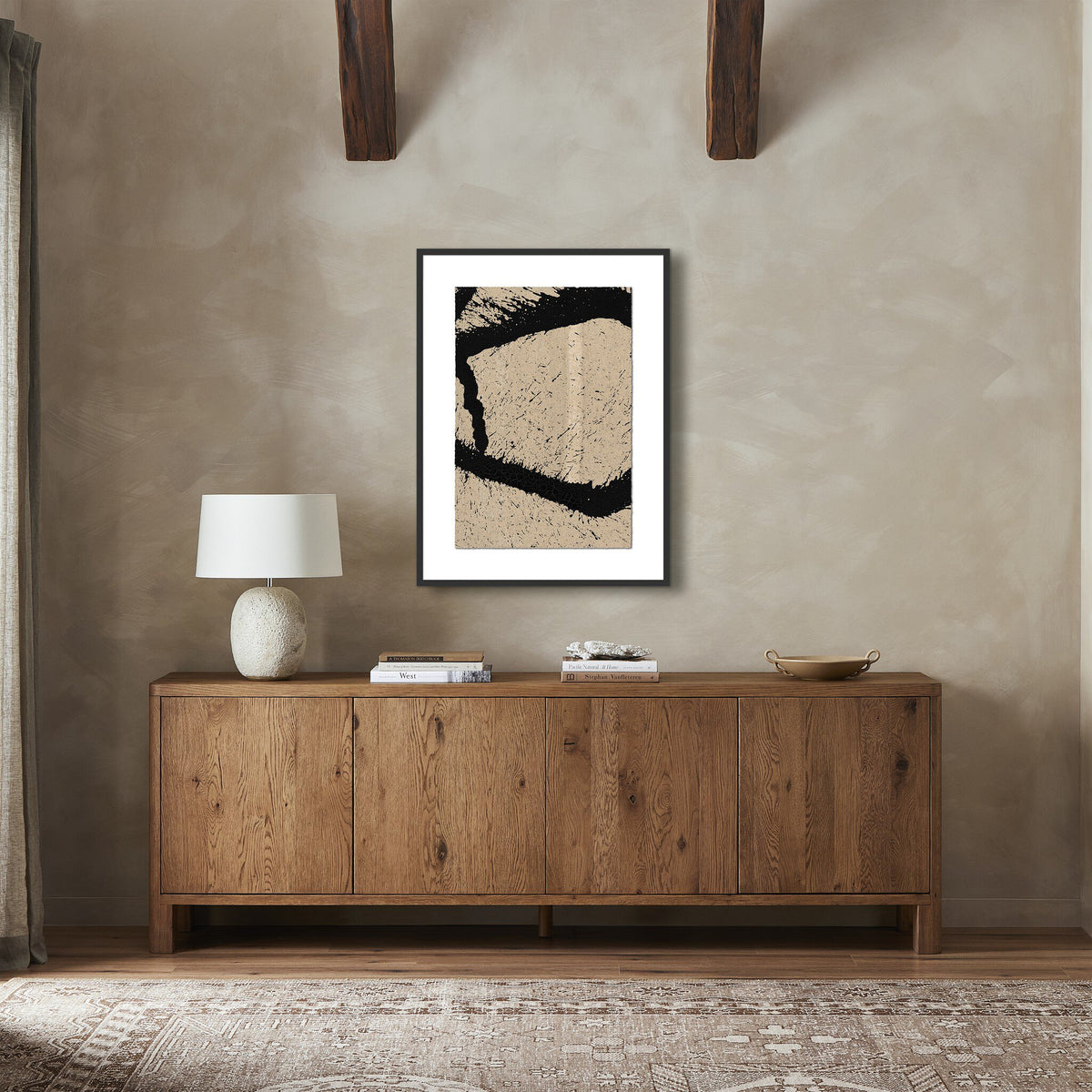a room with a dresser and a painting on the wall