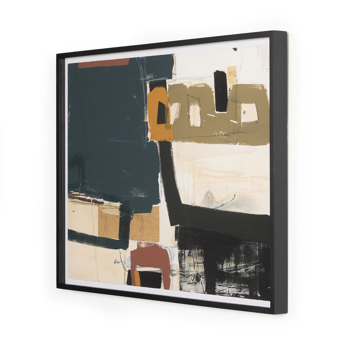a framed art piece on a white wall