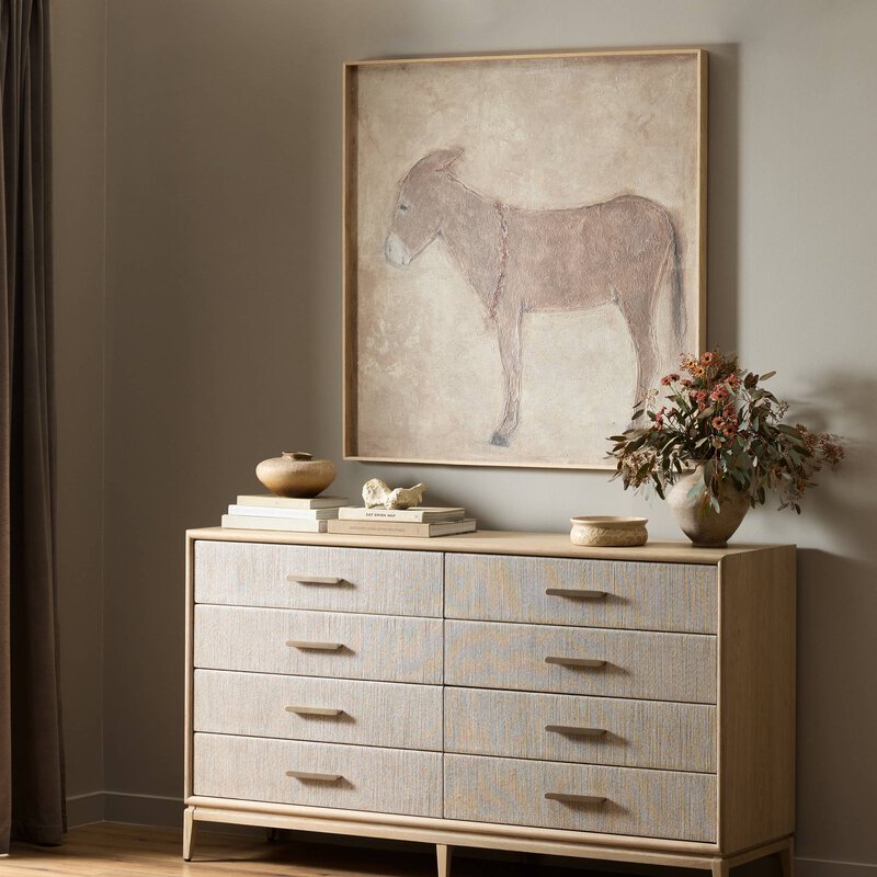 a painting on a dresser